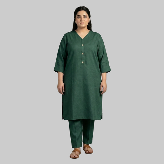 Woman wearing a green kurta with pants on a gray background