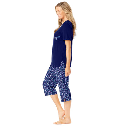 Women’s Pool Blue Cosmic Dreams Plus Size Capri Pajama Set with short-sleeve graphic tee and elastic waist capri bottoms, made from breathable cotton.