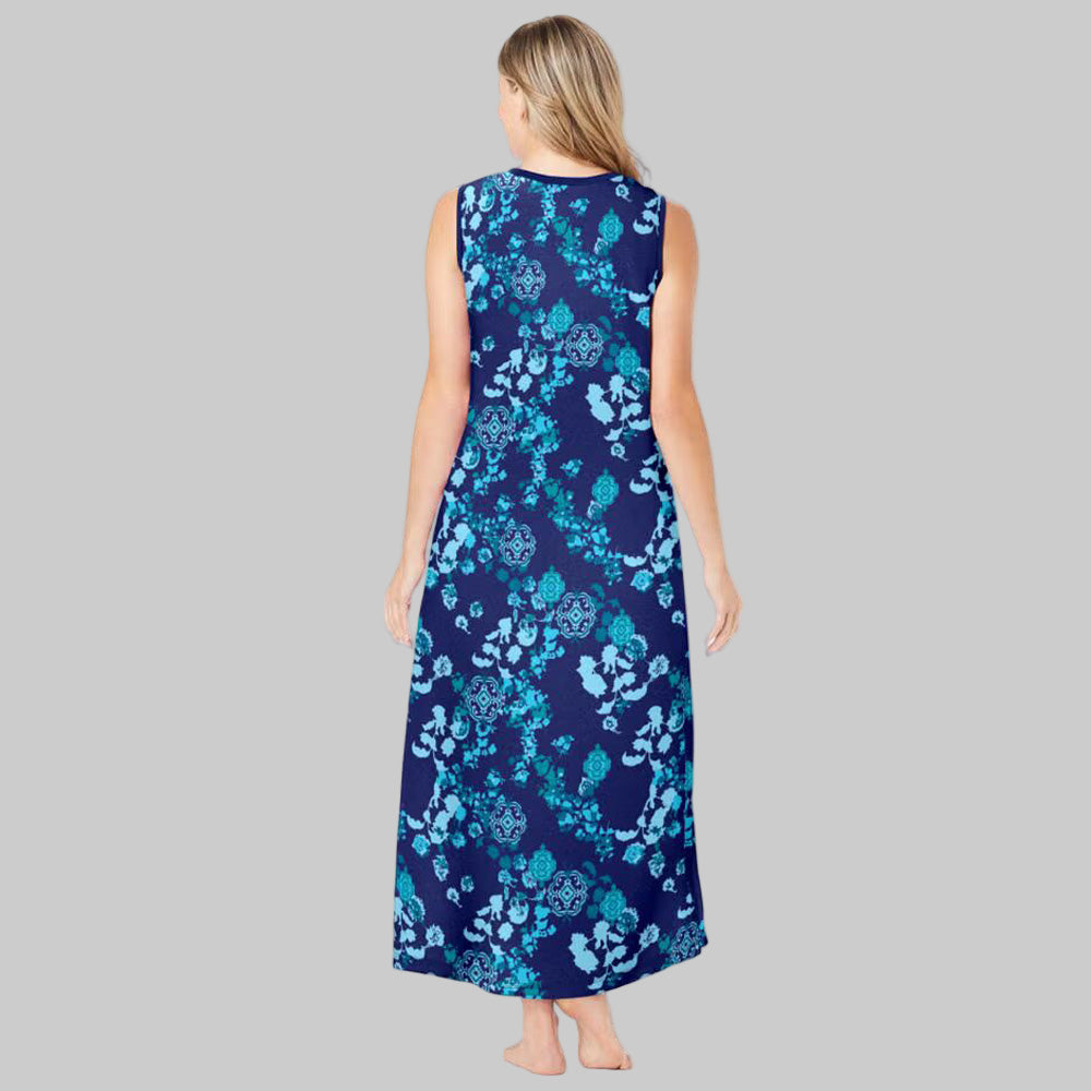Plus-size woman wearing an evening blue sleeveless V-neck lounger with peony floral print, side pockets, and side slits on a white background.