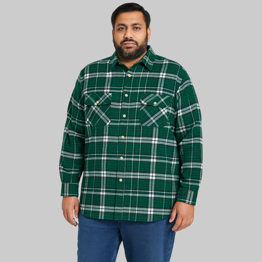 Folded forest green plaid flannel shirt with button-flap chest pockets, long sleeves, and soft cotton fabric — cozy and classic men’s winter shirt.
