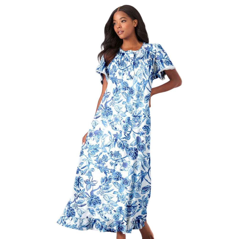 Women’s French blue garden long floral cotton gown with flutter sleeves, ruffled hem, pintucks, and flower-shaped buttons, made from soft breathable cotton.
