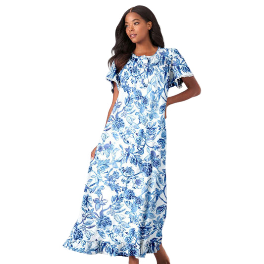 Women’s French blue garden long floral cotton gown with flutter sleeves, ruffled hem, pintucks, and flower-shaped buttons, made from soft breathable cotton.