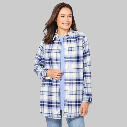 Plus-size woman wearing a French blue and ivory plaid fleece flannel snap-front shirt with long sleeves and tunic-length fit, on a white background.