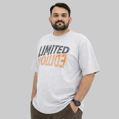 Heather grey limited edition big size crewneck t-shirt worn by a plus-size Pakistani male model in a relaxed fit, front view, studio background