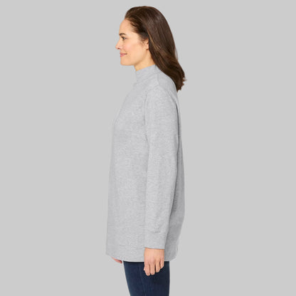Plus-size woman wearing a heather grey long-sleeve mockneck tee with a relaxed fit, displayed on a white studio background.