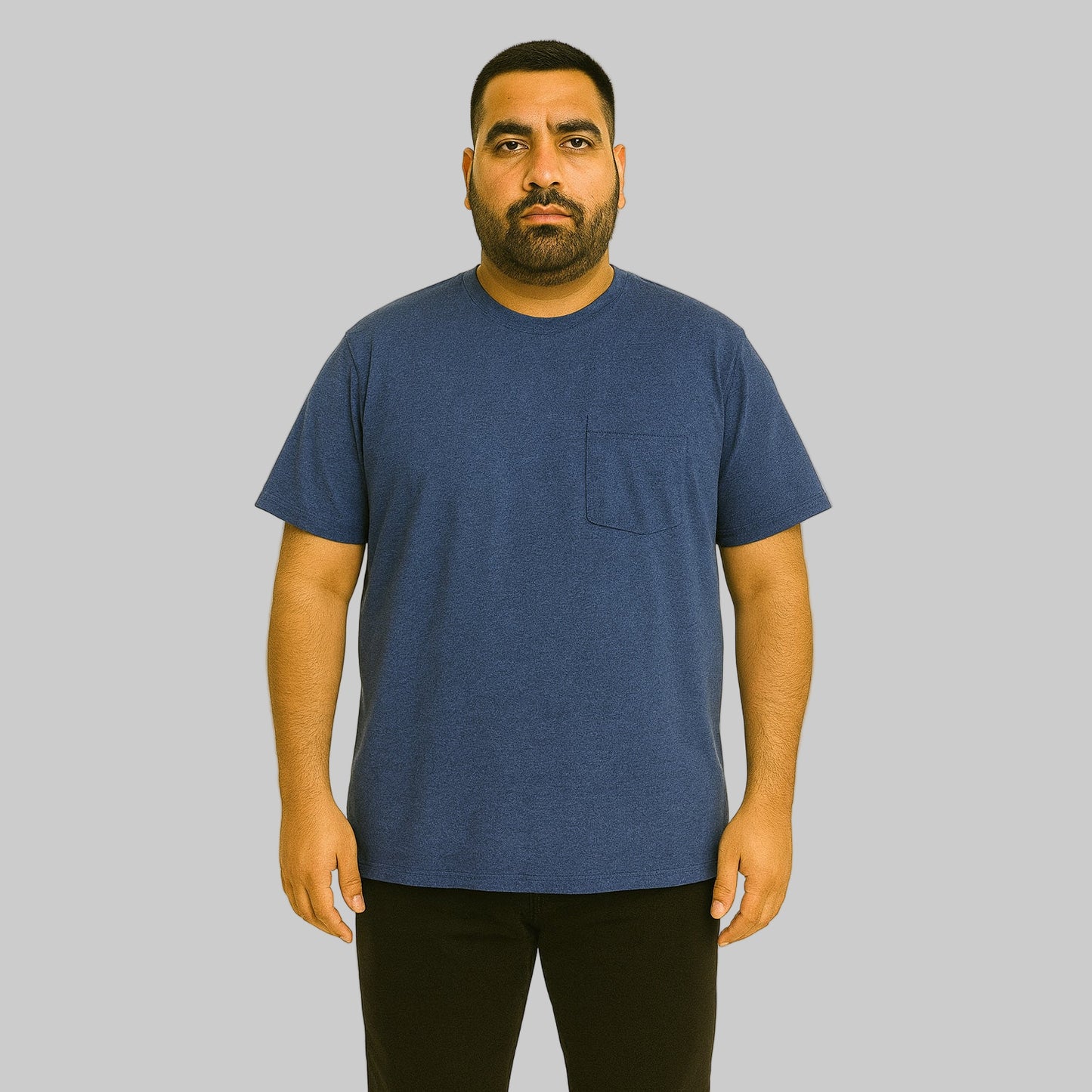 Plus-size Pakistani male model wearing heather navy crewneck T-shirt with chest pocket on a light studio background.