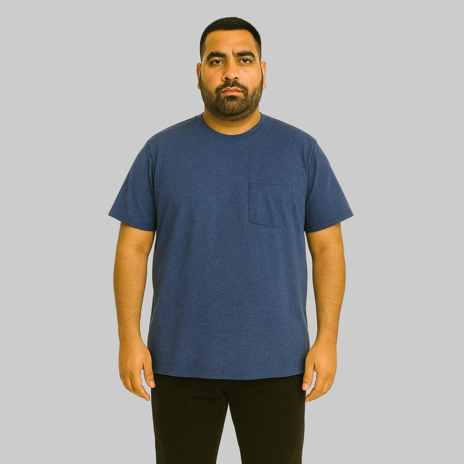 Plus-size Pakistani male model wearing heather navy crewneck T-shirt with chest pocket on a light studio background.