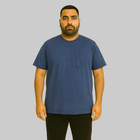 Plus-size Pakistani male model wearing heather navy crewneck T-shirt with chest pocket on a light studio background.