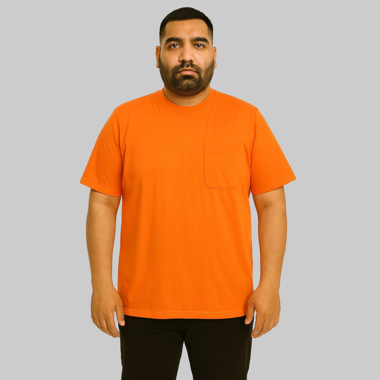 Plus-size Pakistani male model wearing heather orange crewneck pocket T-shirt on a clean studio background.