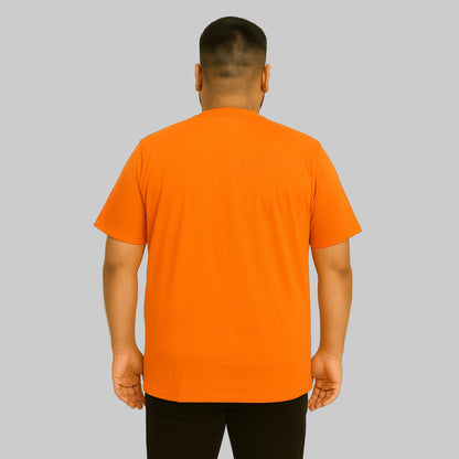 Plus-size Pakistani male model wearing heather orange crewneck pocket T-shirt on a clean studio background.