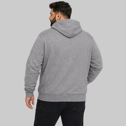 Plus-size male model wearing a heather grey zip-up hoodie with a relaxed fit on a white background