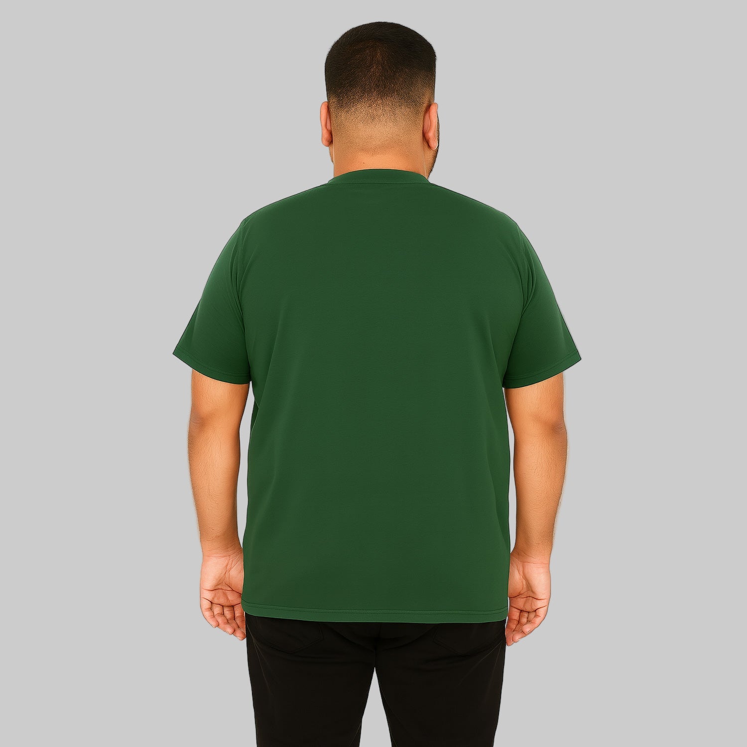 Plus-size male model wearing hunter green Henley T-shirt with 4-button placket, front view, studio background.