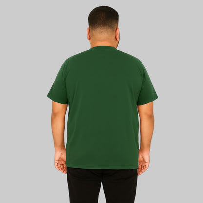 Plus-size male model wearing hunter green Henley T-shirt with 4-button placket, front view, studio background.