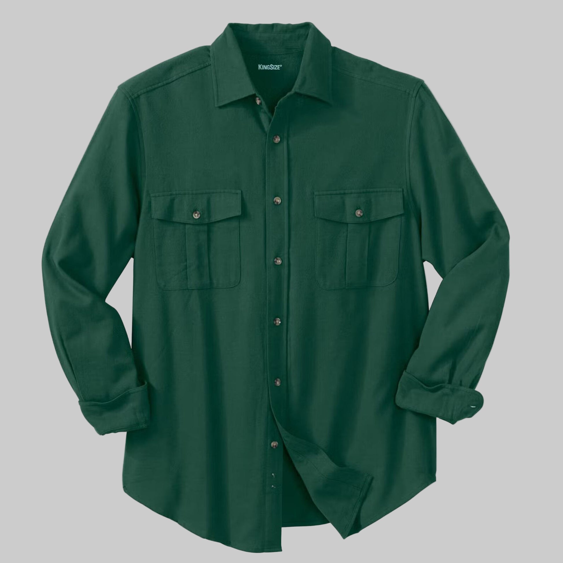Hunter green solid flannel shirt with horn buttons and chest flap pockets, made from soft double-brushed cotton.