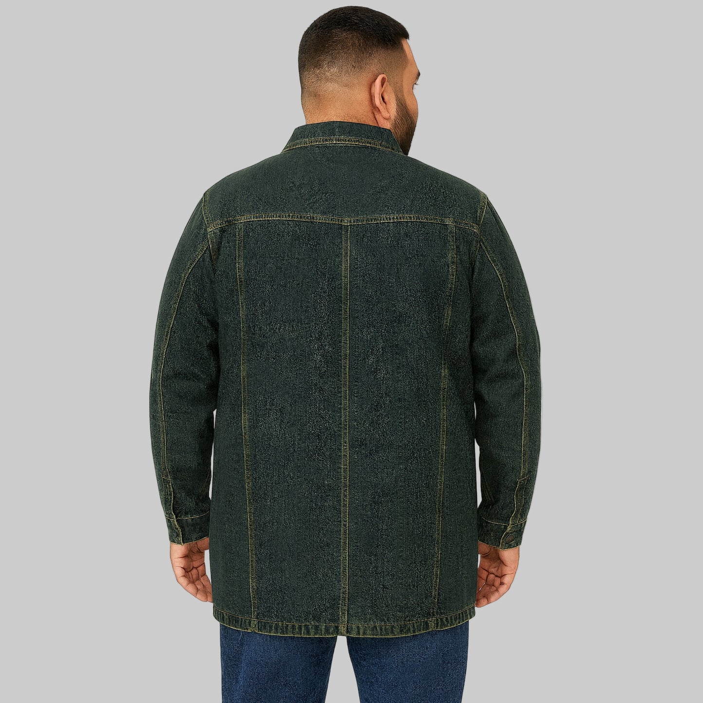 Plus-size male model wearing an indigo full-zip denim jacket with chest flap pockets and side pockets, front view on a clean studio background.