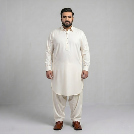 Man wearing a white kurta with white pants on a gray background