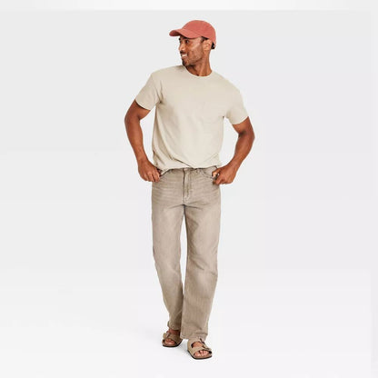 Plus-size male model wearing Khaki Relaxed Fit Jeans, mid-rise relaxed leg, classic 5-pocket design, stretch denim texture, studio front view.