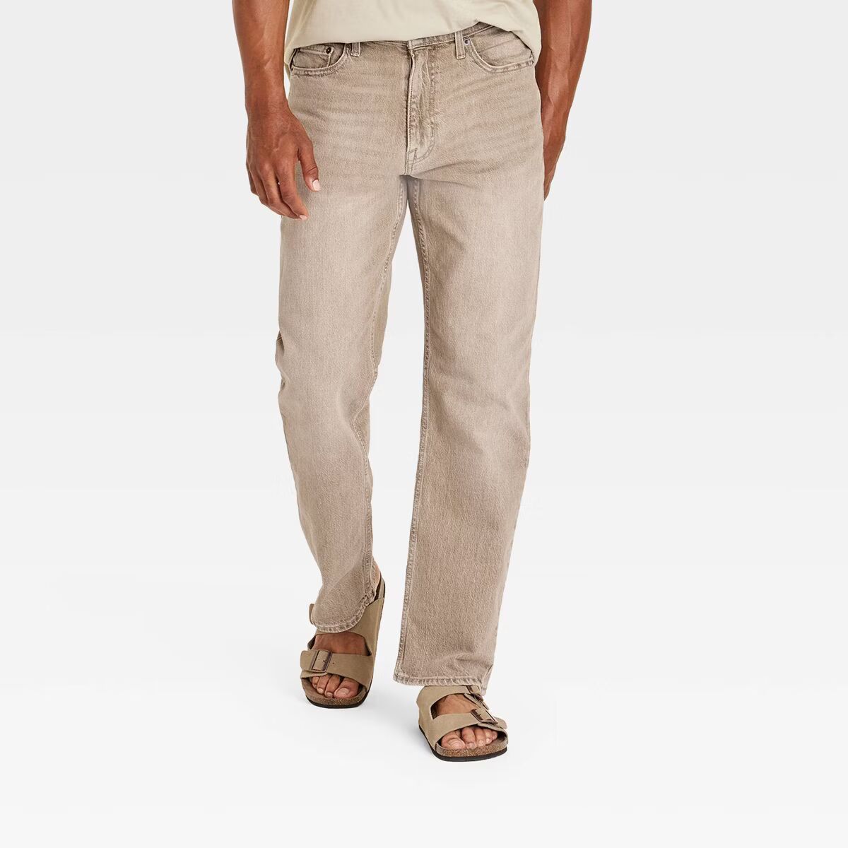 Plus-size male model wearing Khaki Relaxed Fit Jeans, mid-rise relaxed leg, classic 5-pocket design, stretch denim texture, studio front view.