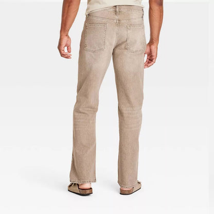 Plus-size male model wearing Khaki Relaxed Fit Jeans, mid-rise relaxed leg, classic 5-pocket design, stretch denim texture, studio front view.