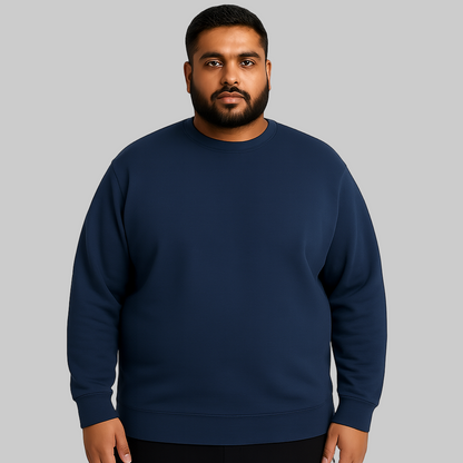 Plus-size model wearing a Land Navy Fleece Crewneck Sweatshirt in navy, long sleeves, rib-knit cuffs, and crew neckline, front view