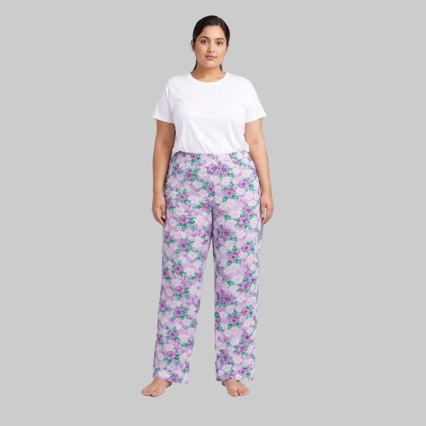 Lavender floral printed cotton flannel pajama pants with elastic waistband laid flat