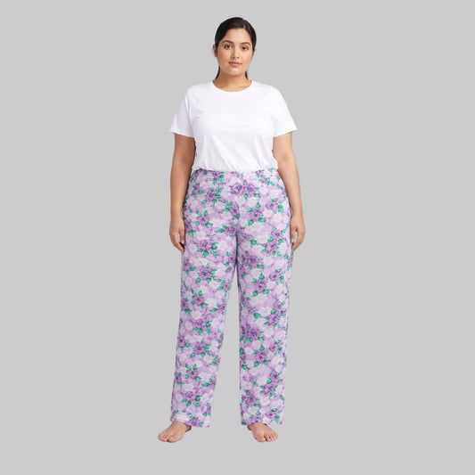 Lavender floral printed cotton flannel pajama pants with elastic waistband laid flat