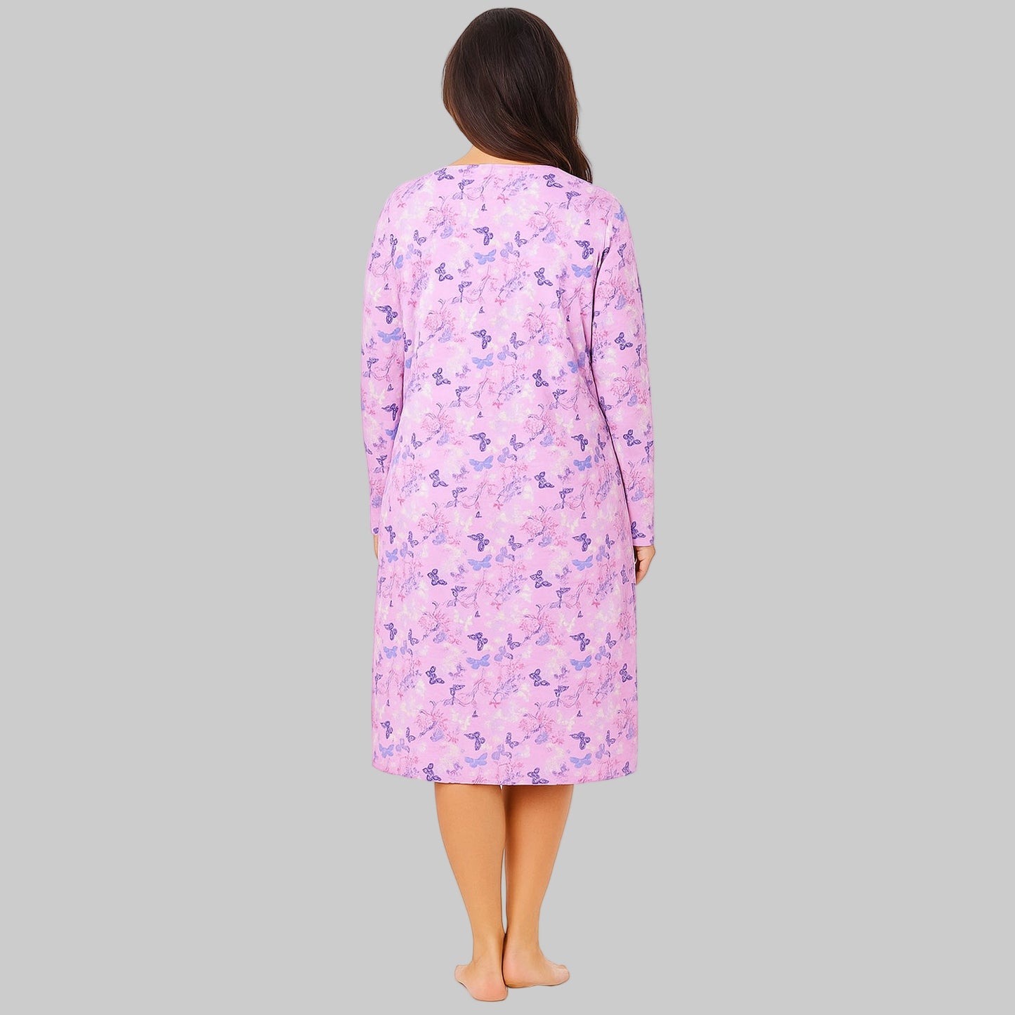 Plus-size woman wearing a lavender long-sleeve cotton sleepshirt with a relaxed fit, photographed on a clean white background.