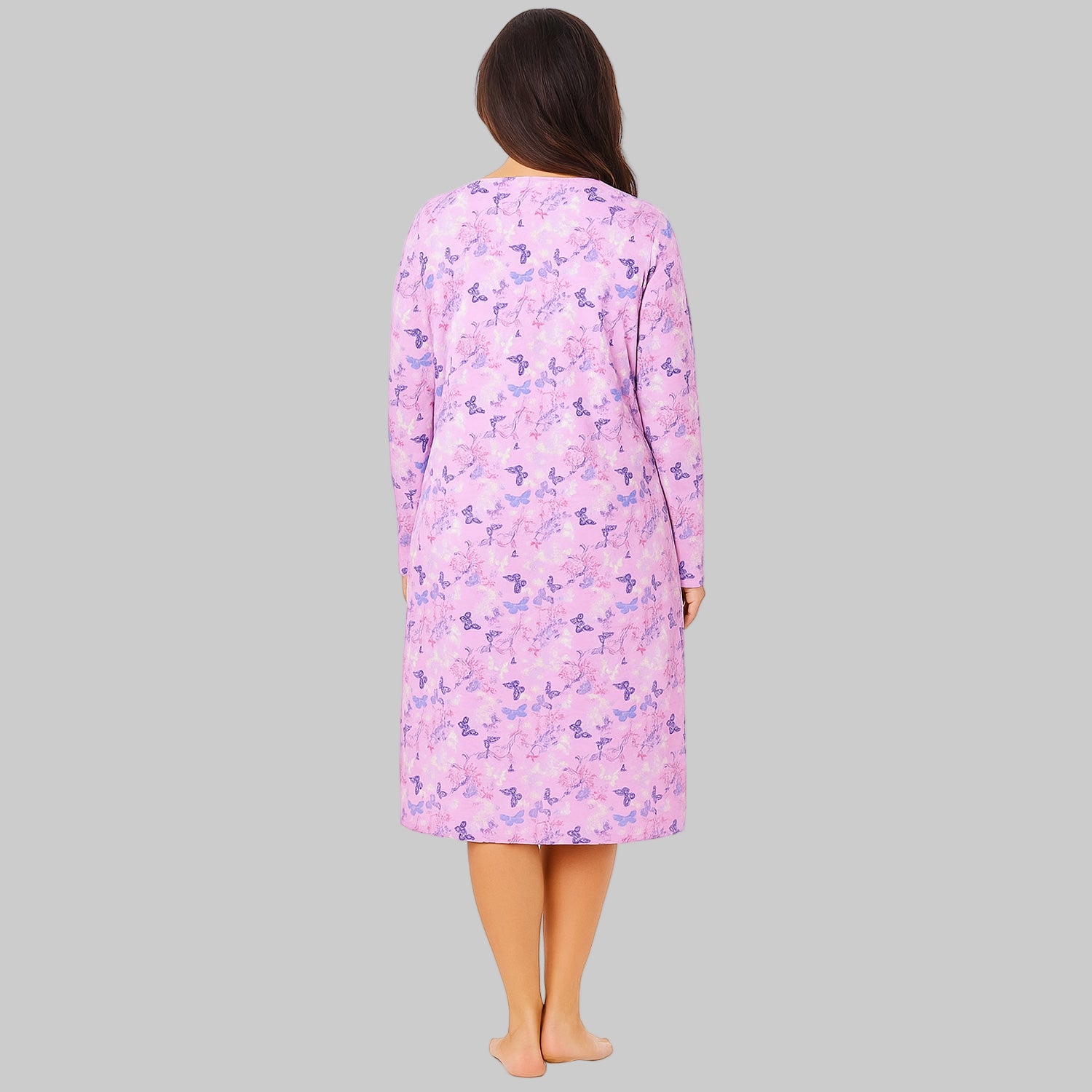 Plus-size woman wearing a lavender long-sleeve cotton sleepshirt with a relaxed fit, photographed on a clean white background.