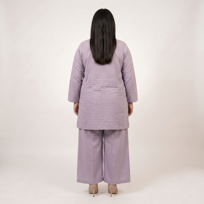 Front view of a woman wearing a Lavender Mist Co-Ord Set featuring a solid lavender textured tunic with an embellished neckline and matching wide-leg trousers.