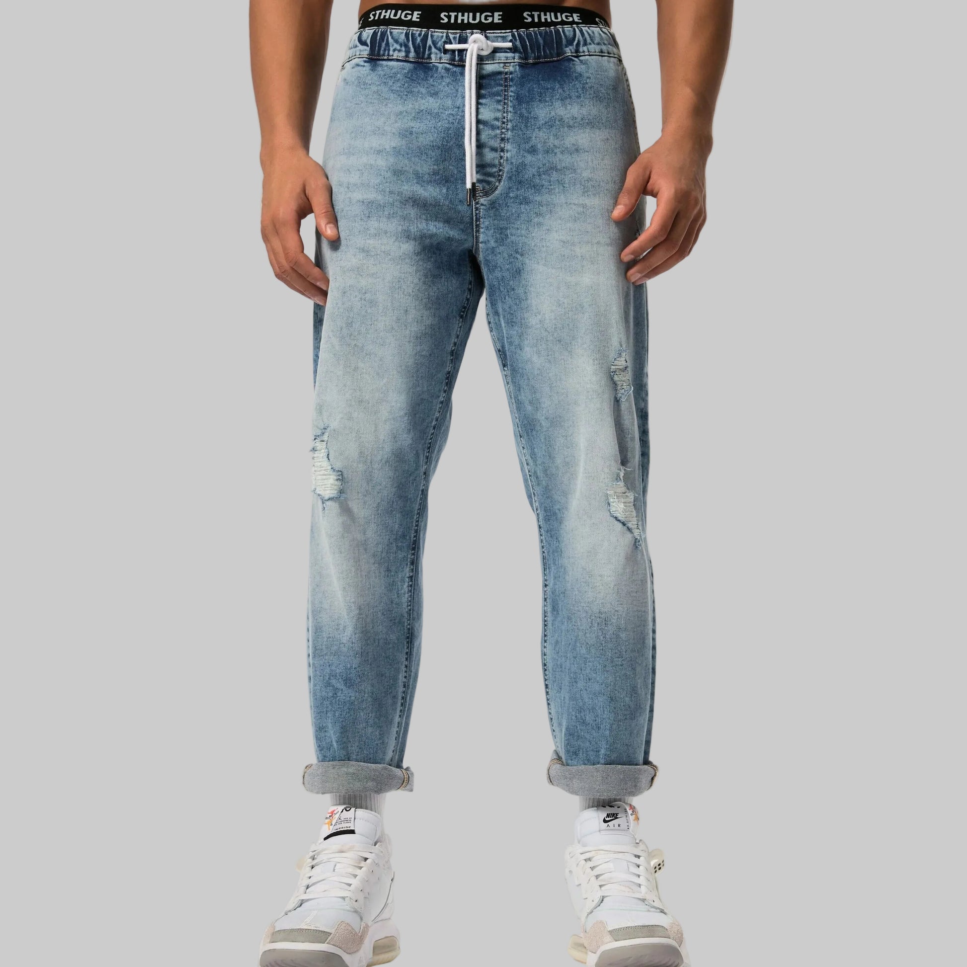 Light blue straight leg denim jeans with elasticated waist, stretch fabric, side and back pockets, and a relaxed everyday fit.