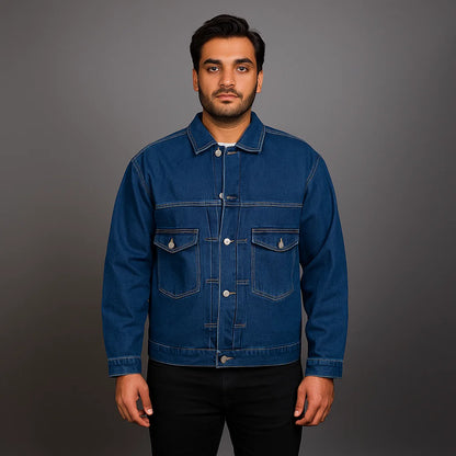 Man wearing a classic indigo button-up denim jacket with flap chest pockets and straight fit

