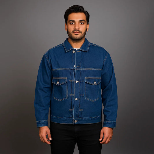 Man wearing a classic indigo button-up denim jacket with flap chest pockets and straight fit

