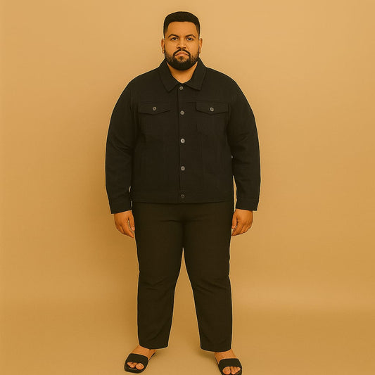 Plus-size man wearing black denim jacket with button front and flap chest pockets