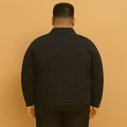 Plus-size man wearing black denim jacket with button front and flap chest pockets