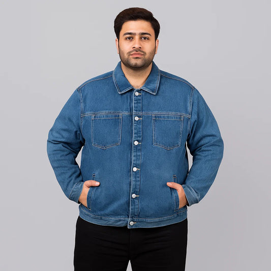 Plus-size man wearing mid-wash utility denim jacket with chest patch pockets and side hand pockets