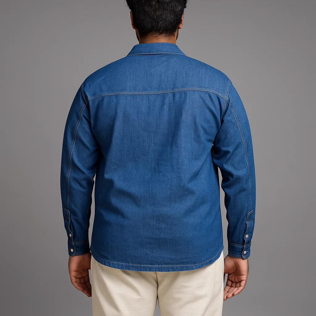 Plus-size man wearing blue denim shirt jacket with button front and utility-style pockets