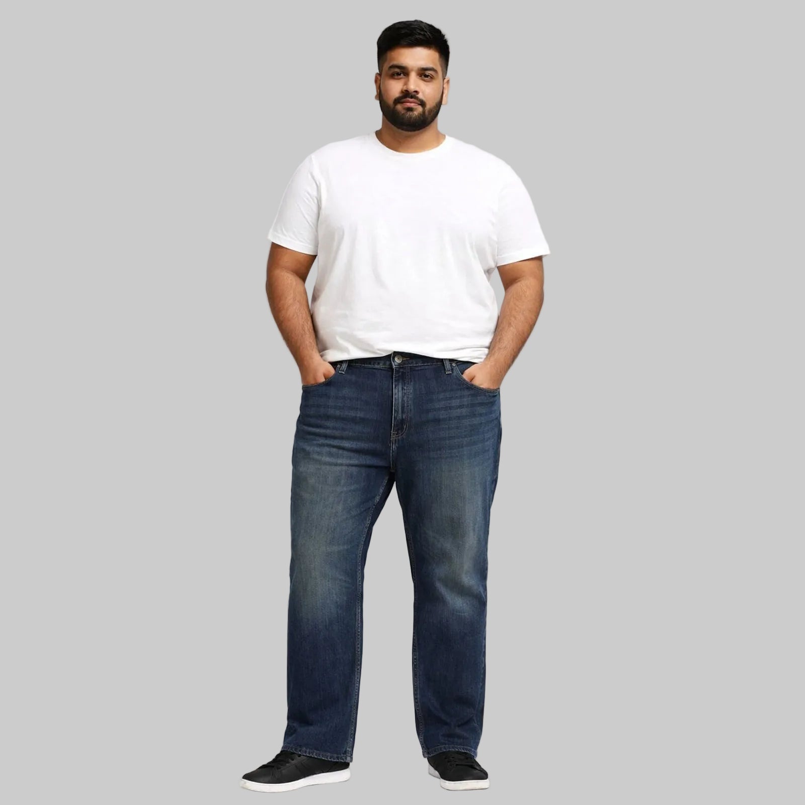 Medium blue straight leg denim jeans featuring stretch cotton fabric, normal rise, concealed fly, classic pockets, and a clean everyday finish