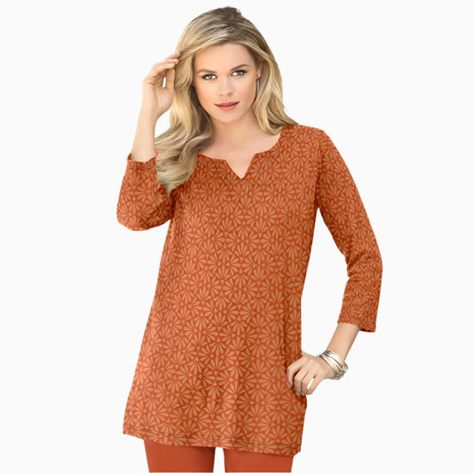 Plus-size soft knit tunic with a stitched notch neckline, three-quarter sleeves, side slits, and a relaxed fit. Made from a breathable cotton/poly blend.
