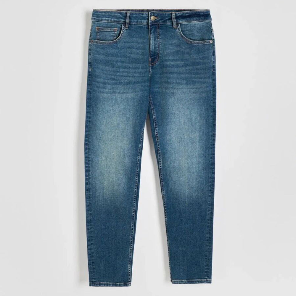 Men’s mid blue stretch slim fit denim jeans with fitted legs and clean wash, front studio view