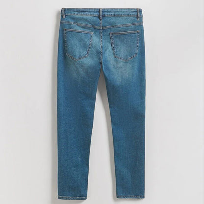 Men’s mid blue stretch slim fit denim jeans with fitted legs and clean wash, front studio view