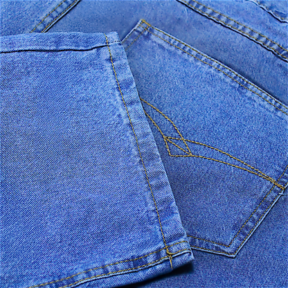 Men’s mid wash elasticated waist jeans with straight leg, button and zip fastening, belt loops, front and rear pockets, made from 100% cotton denim."