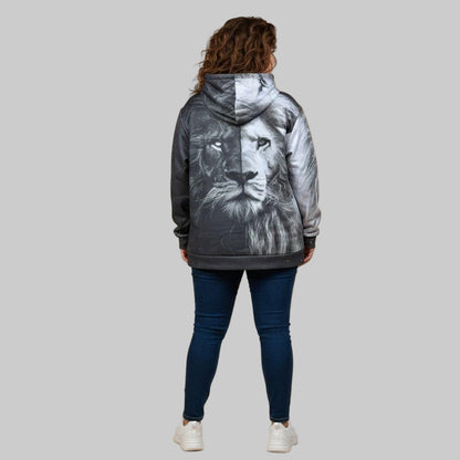 Plus-size male and female models wearing black “Midnight Strength” graphic hoodies with front print, styled in a cozy modern studio setup.