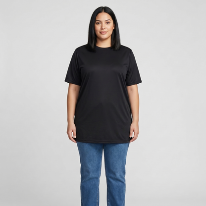 Woman wearing a black t-shirt and blue jeans on a gray background