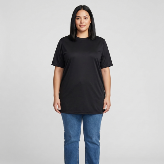Woman wearing a black t-shirt and blue jeans on a gray background