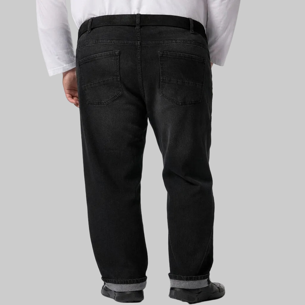 Midnight Rift distressed denim pants in deep indigo wash with light fading, subtle ripped details, straight fit silhouette, classic five-pocket styling, and durable stitching for everyday wear