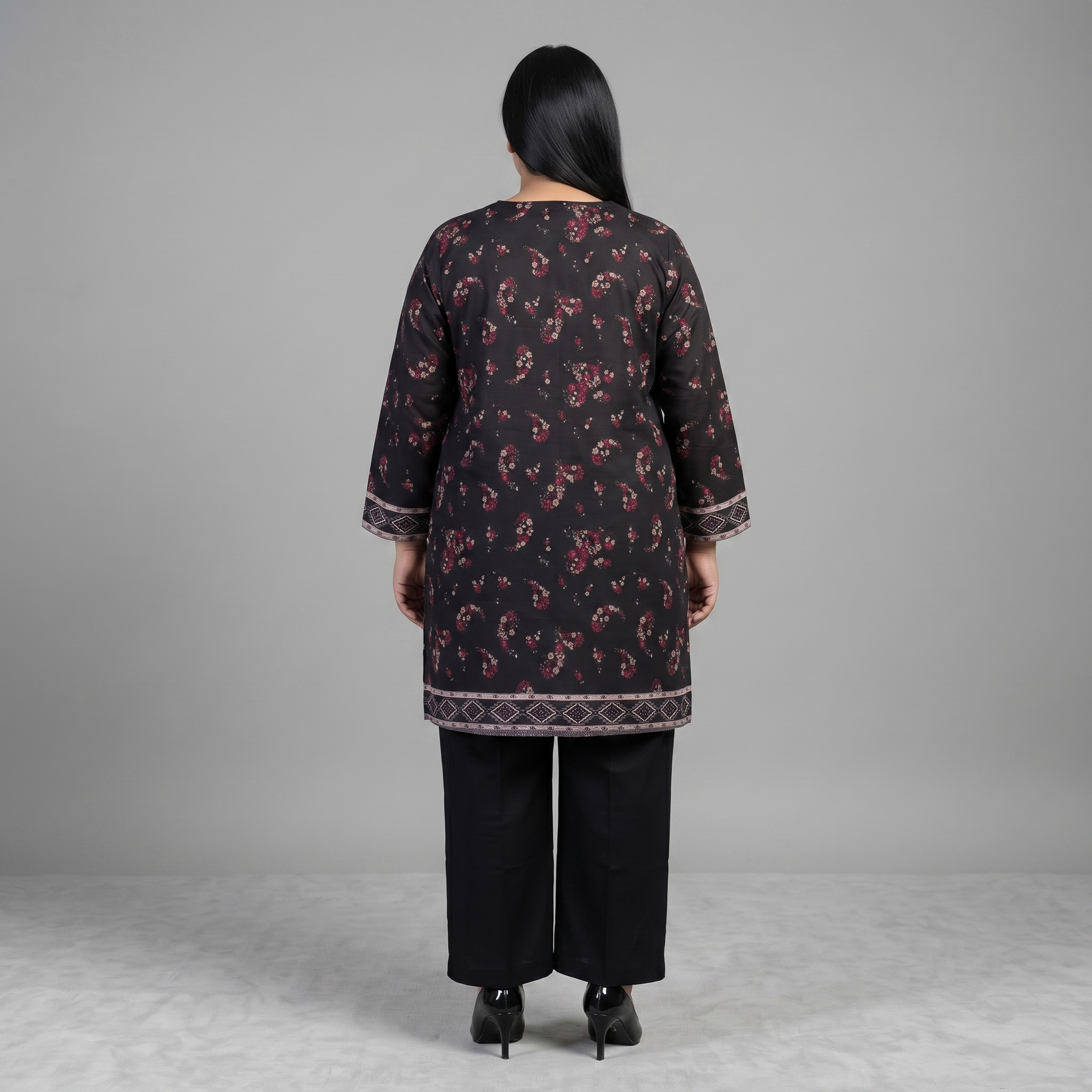 Woman wearing a Midnight Rose Printed 3-Piece Suit featuring a black floral printed shirt, solid black trousers, and a maroon floral printed dupatta with decorative border detailing.