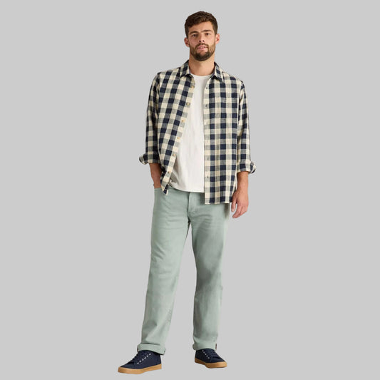 Mint tapered fit jeans with cotton stretch fabric, normal rise, belt loops, and side and back pockets.