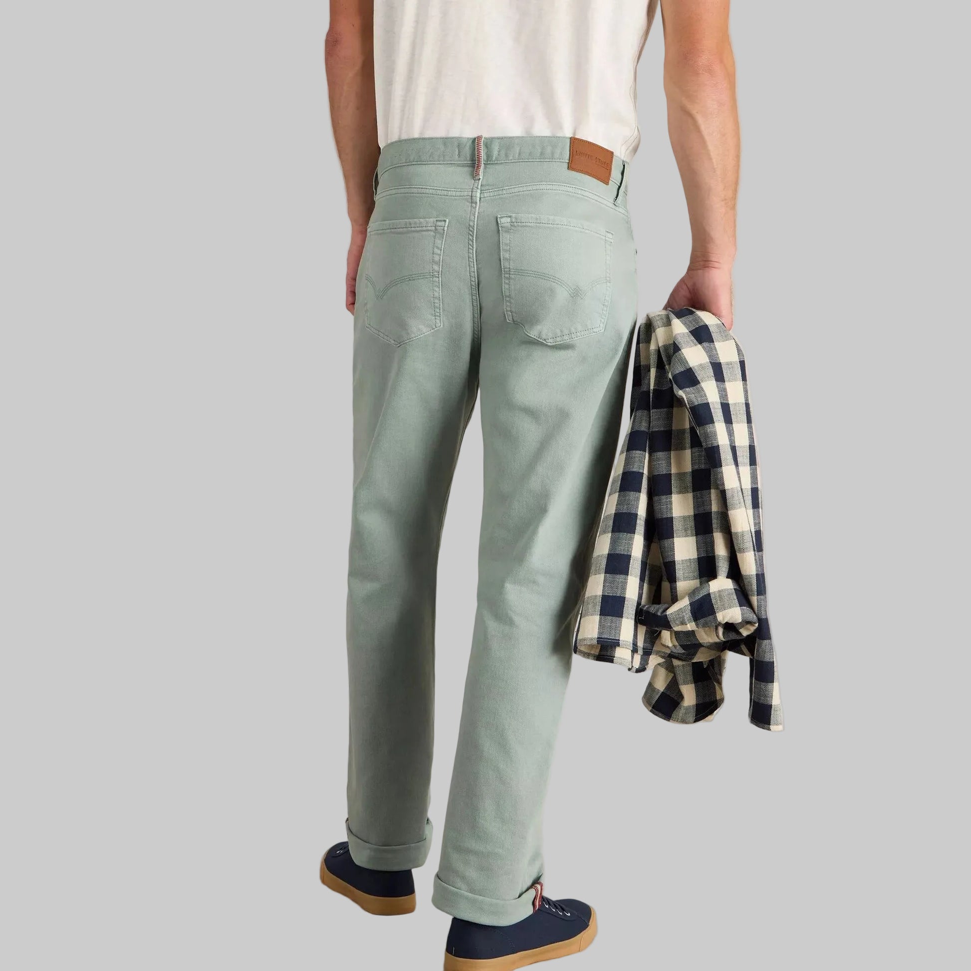 Mint tapered fit jeans with cotton stretch fabric, normal rise, belt loops, and side and back pockets.