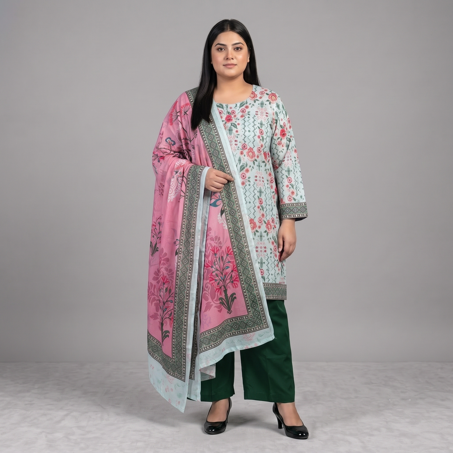 Woman wearing a Mint Blossom Printed 3-Piece Suit featuring a mint floral printed straight-fit shirt, green trousers, and a pink floral printed dupatta with decorative border.