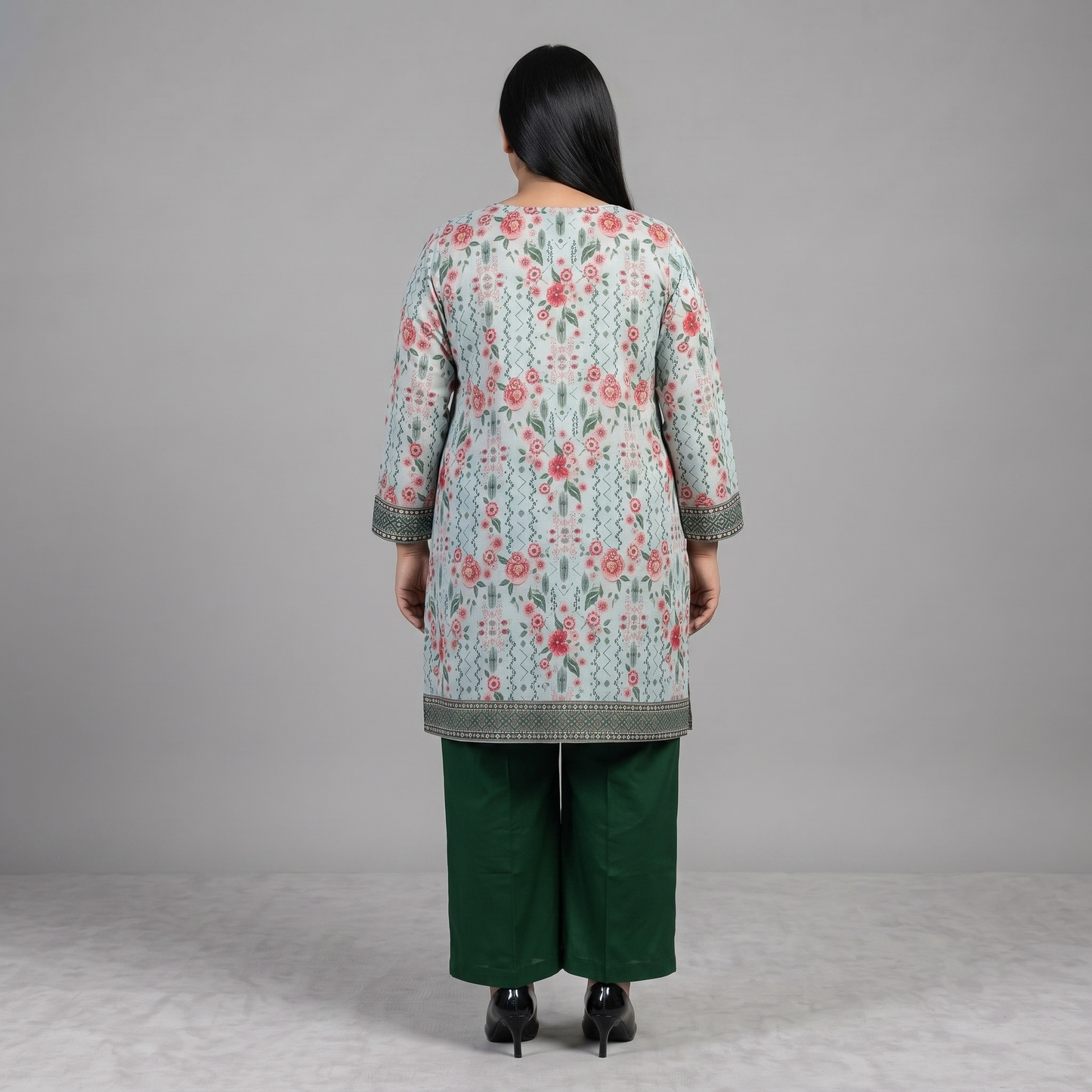Woman wearing a Mint Blossom Printed 3-Piece Suit featuring a mint floral printed straight-fit shirt, green trousers, and a pink floral printed dupatta with decorative border.